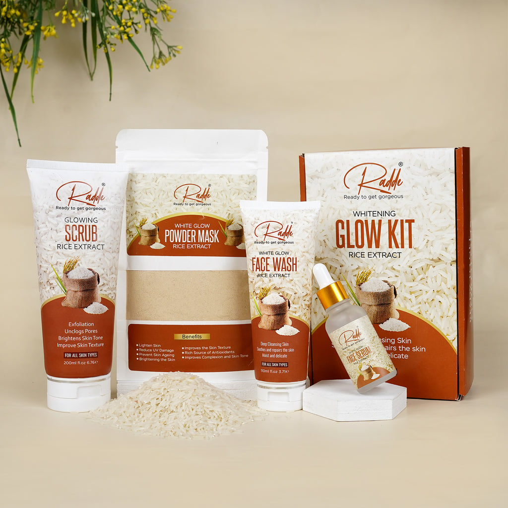 A skincare product set labeled 'Radde' including a face wash, face scrub, powder mask, and face serum, all packaged in white tubes and a box against a beige background.